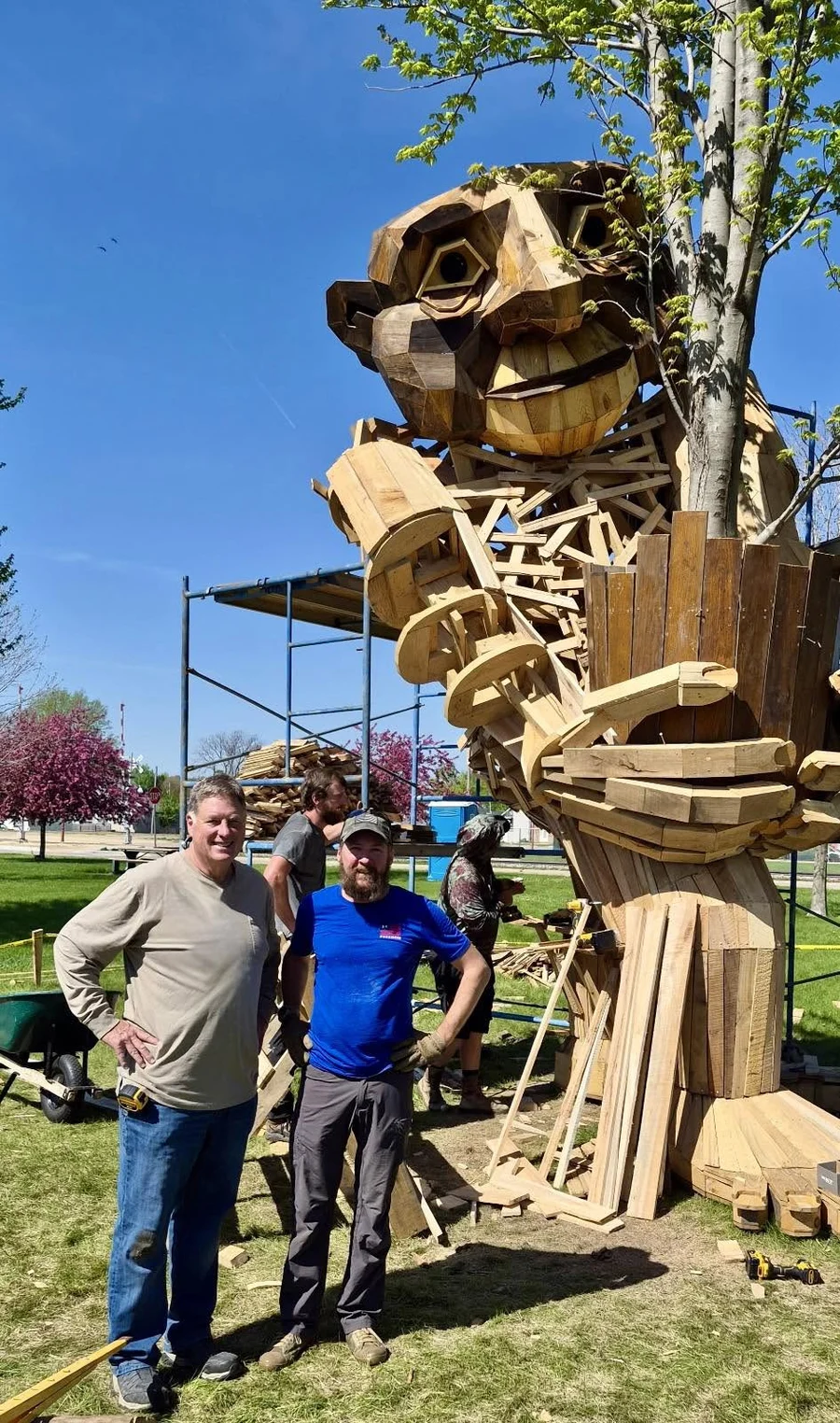 Mark and Drew Mangler in front of the troll sculpture under construction at the Sawmill Museum