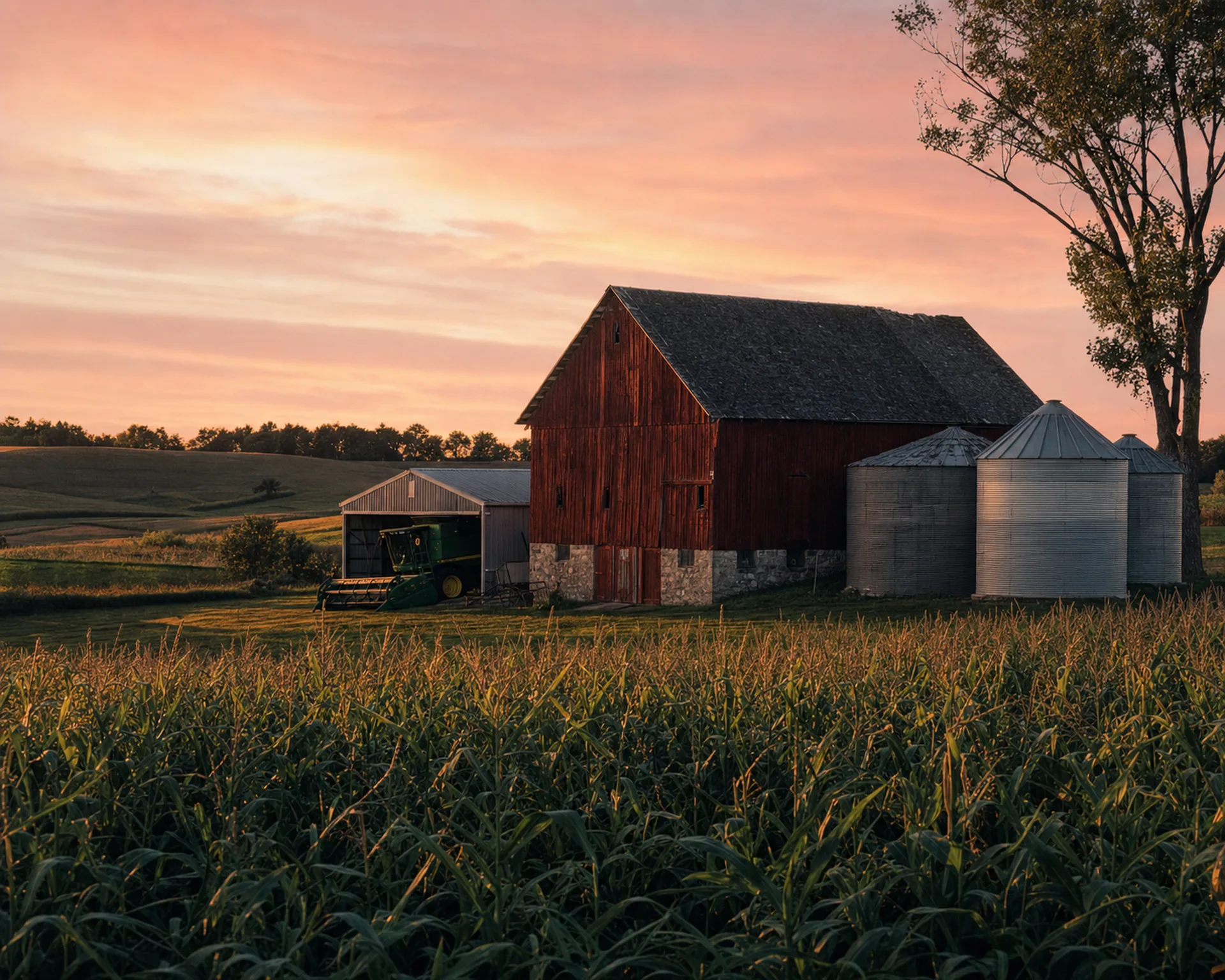 Iowa farmstead with silos at dusk